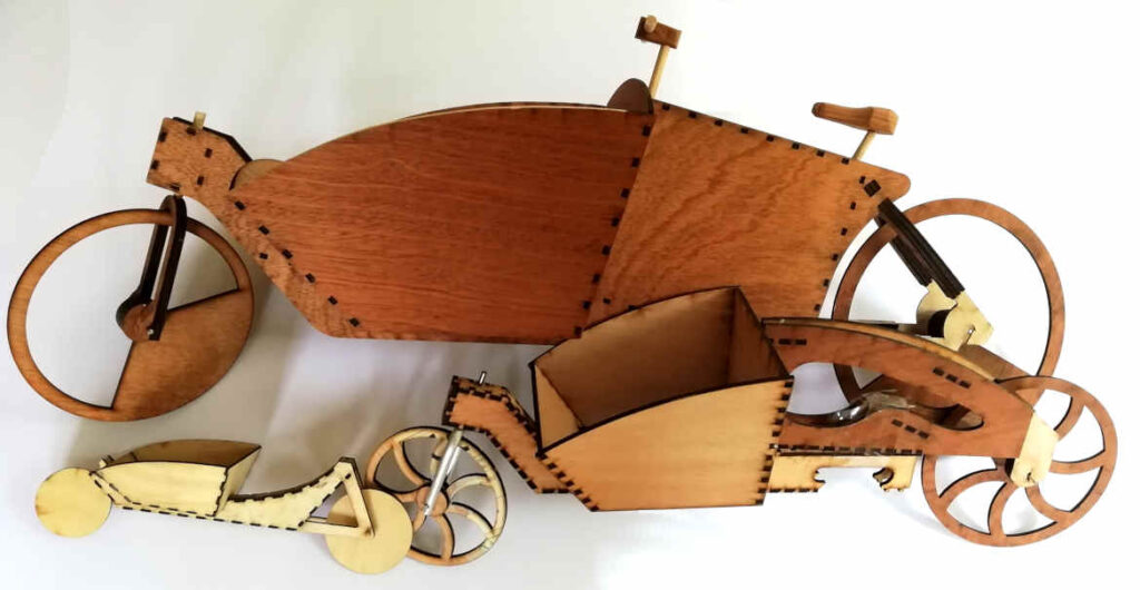 A collection of laser cut models of cargo bikes