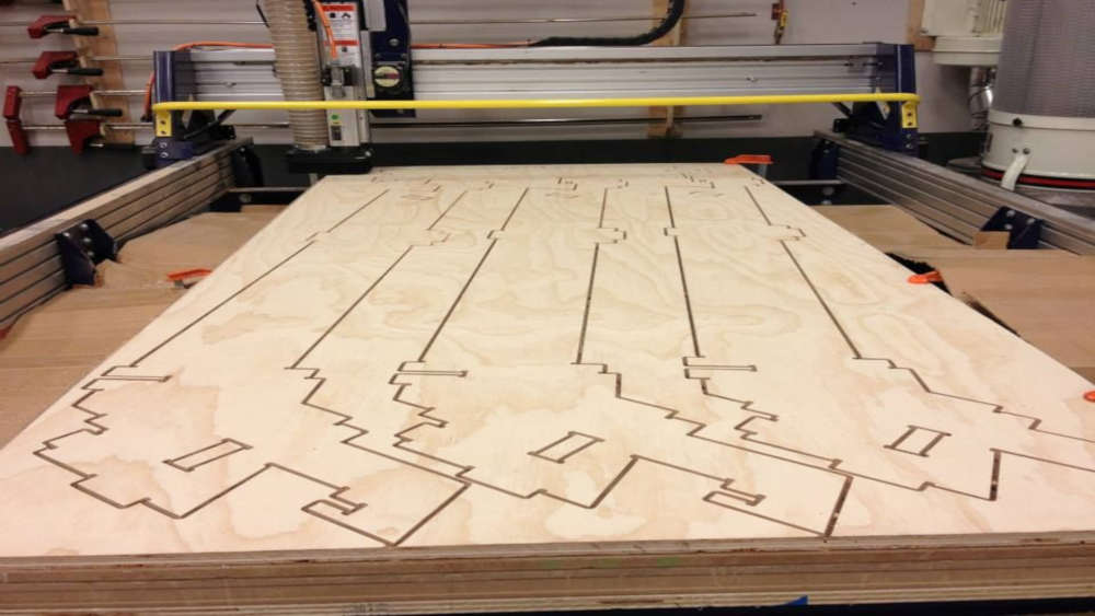 Wikihouse parts cut into a sheet of plywood